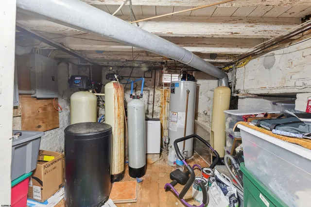 a bathroom with granite countertop shower and sink