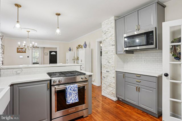 a kitchen with a stove and a microwave