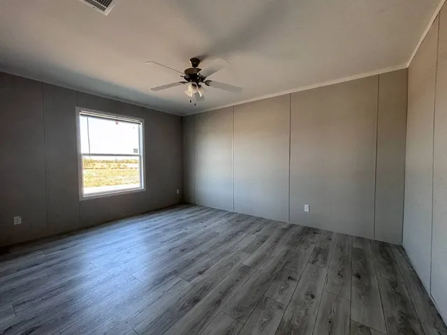 a backyard of a house with lots of green space
