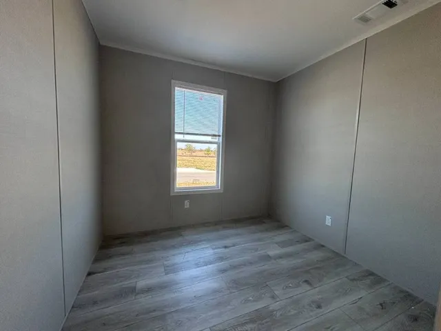 a view of a lake with a house in the background