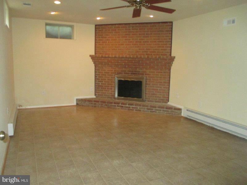 920 Annapolis Road Gambrills, MD 21054 - Photo 26 of 30 Lower Level Rec Room with Wood Burning FP