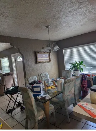 a kitchen with a refrigerator a sink and cabinets