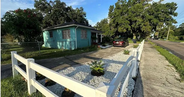 a front view of house with outdoor seating and yard