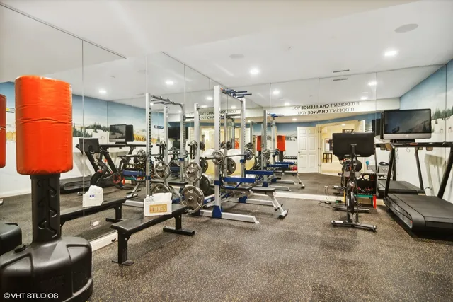 a view of a big house with a big yard and large trees