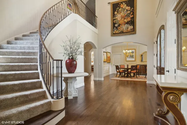 a view of entryway livingroom and hall with wooden floor