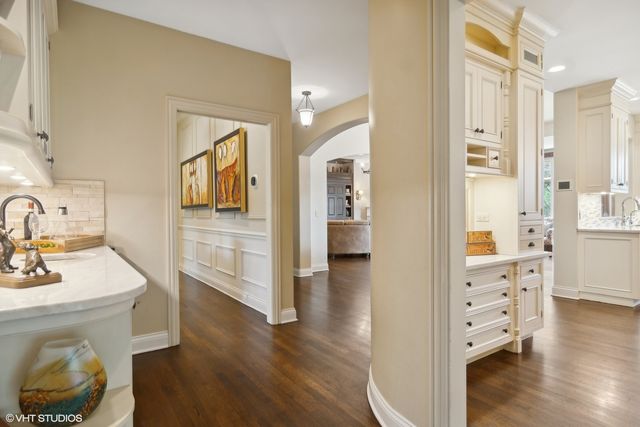 a kitchen with stainless steel appliances granite countertop a sink stove and cabinets