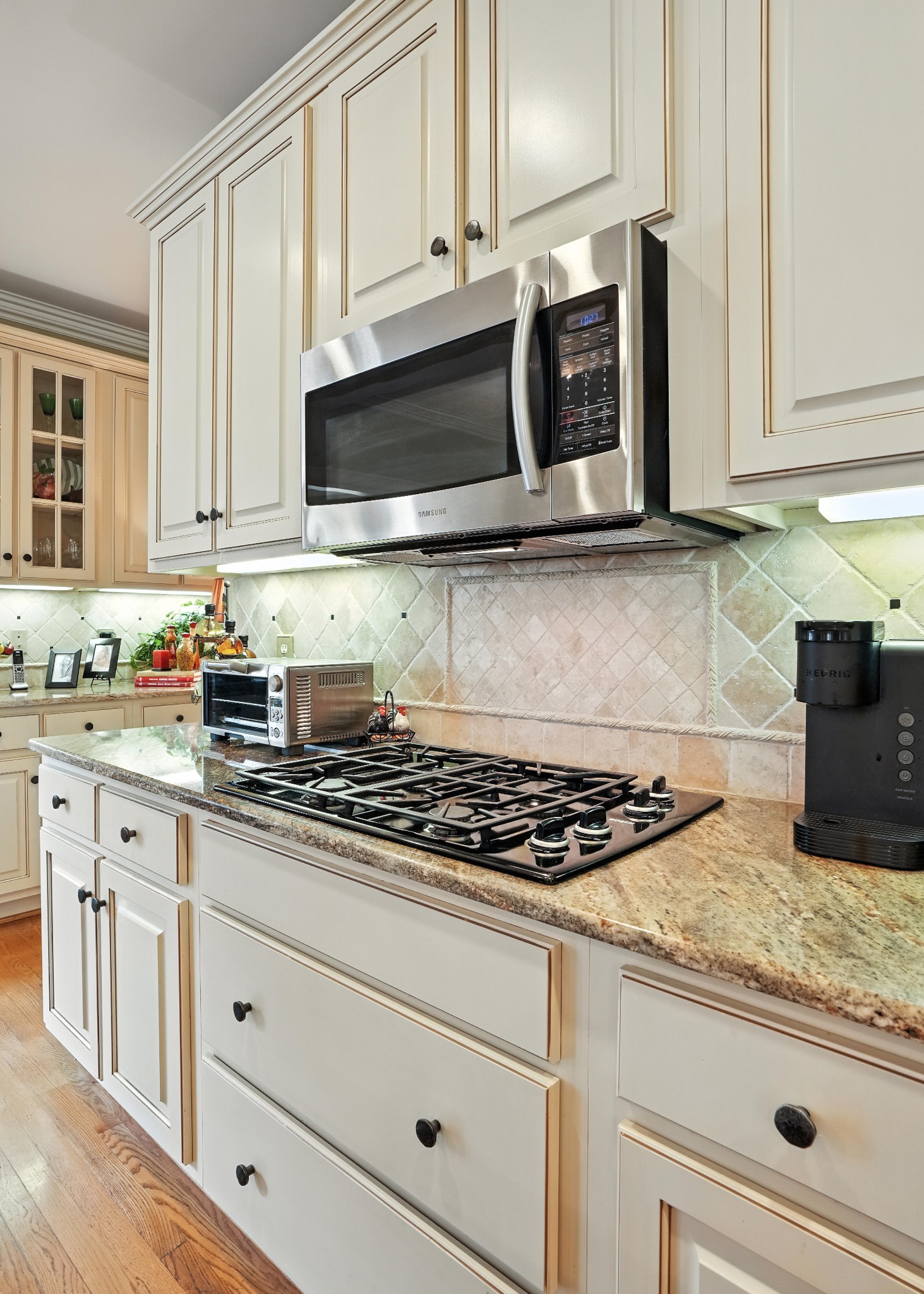 216 Lake Ridge Court Franklin, TN 37069 - Photo 30 of 75 a kitchen with granite countertop white cabinets and stainless steel appliances