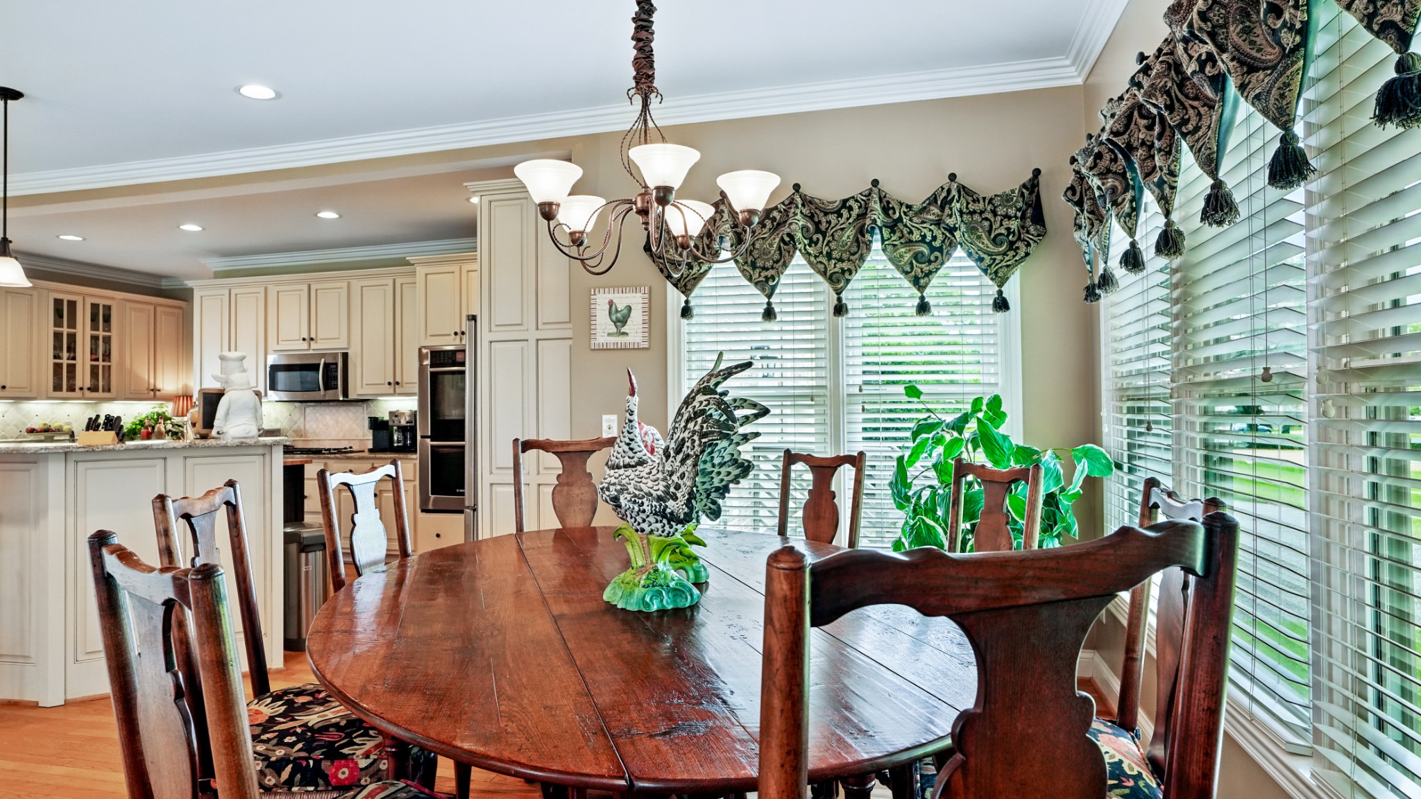 216 Lake Ridge Court Franklin, TN 37069 - Photo 36 of 75 a dining room filled chandelier and wooden floor