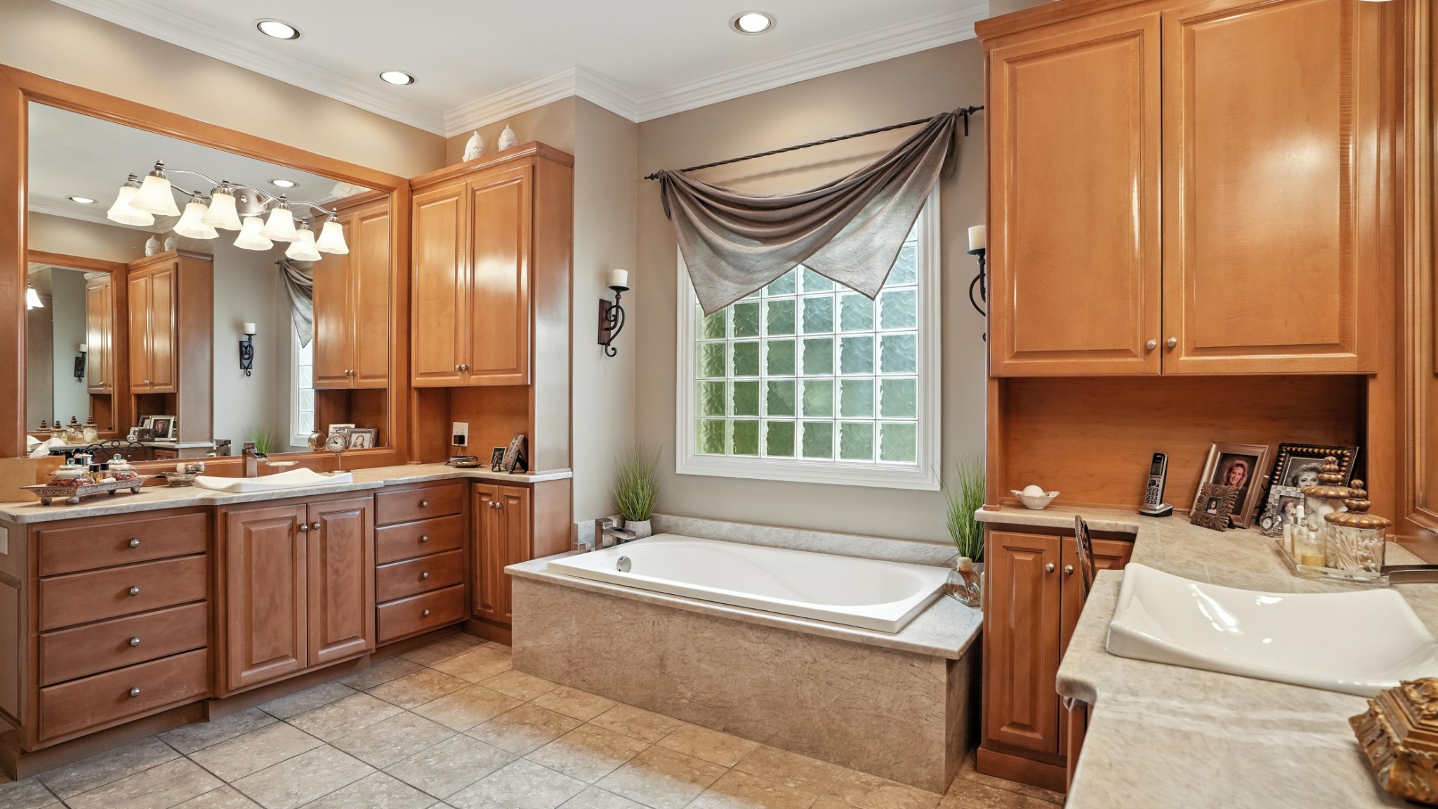 216 Lake Ridge Court Franklin, TN 37069 - Photo 51 of 75 a spacious bathroom with a granite countertop tub sink a mirror and a bathtub