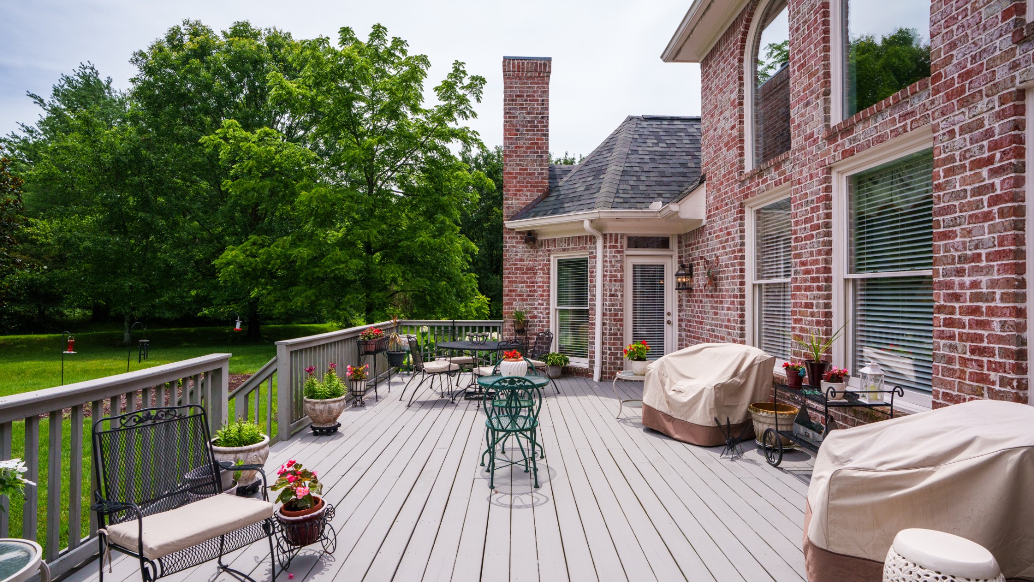 216 Lake Ridge Court Franklin, TN 37069 - Photo 65 of 75 a view of deck with table and chairs couches with wooden floor and fence