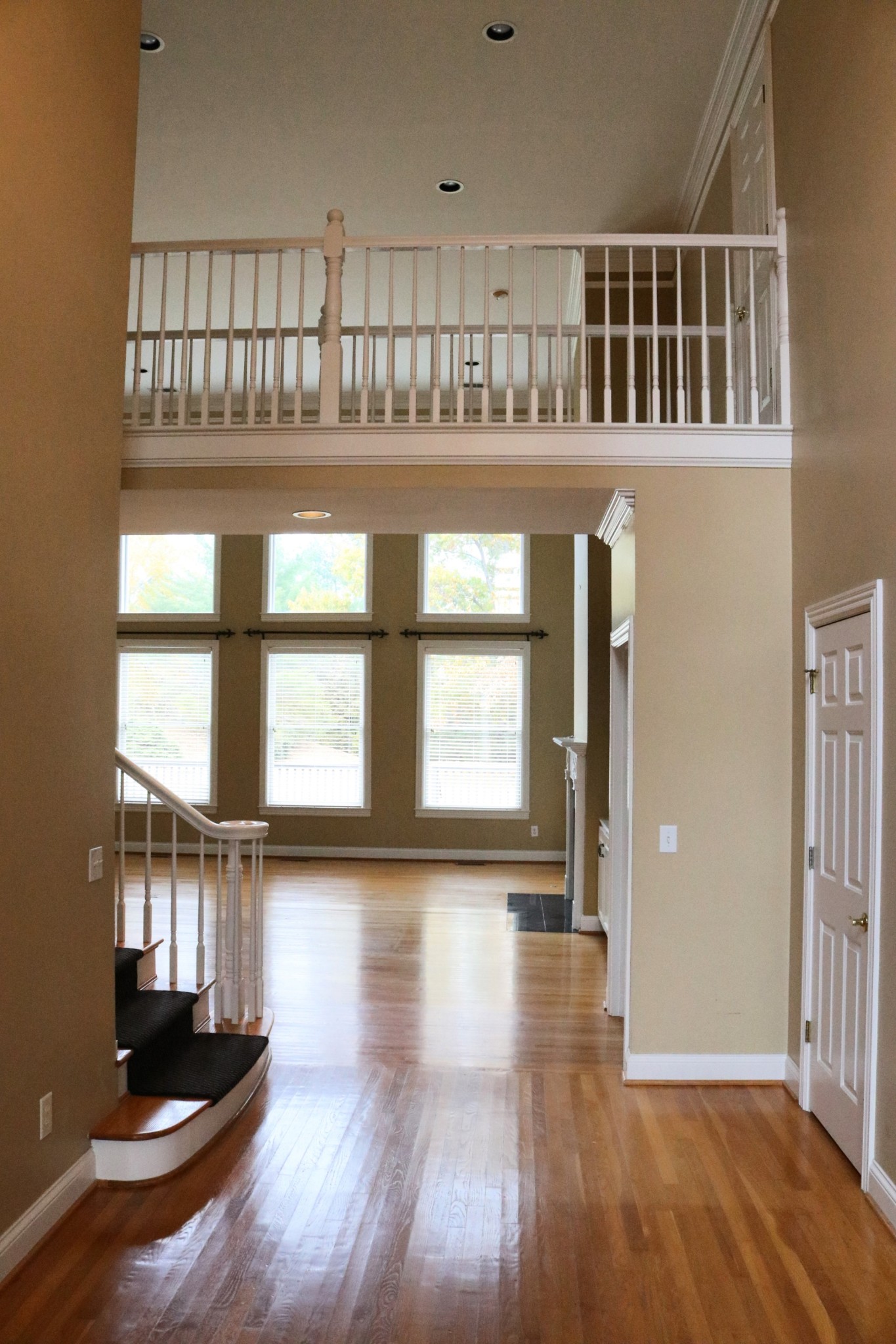 216 Lake Ridge Court Franklin, TN 37069 - Photo 9 of 75 a view of empty room with wooden floor and fan
