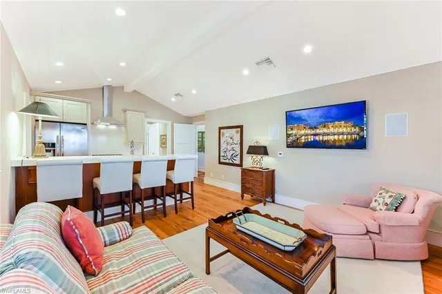 a living room with furniture and a table