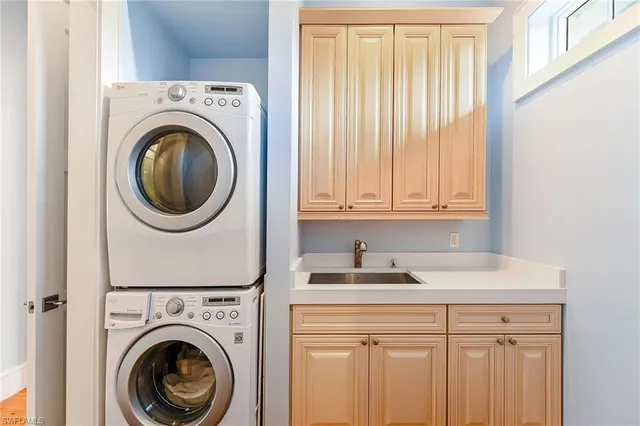a view of a lake with couches chairs and a table