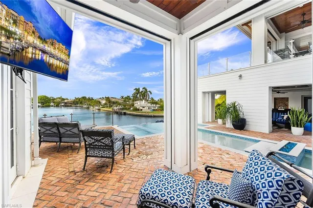 a view of a swimming pool with a lounge chairs