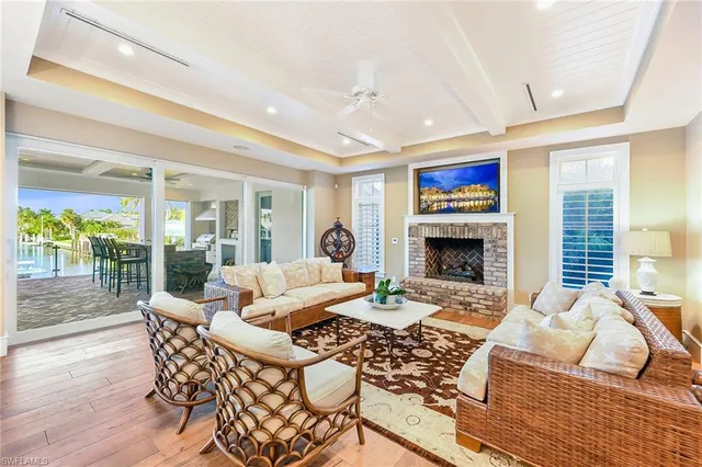 a living room with furniture fireplace and a table
