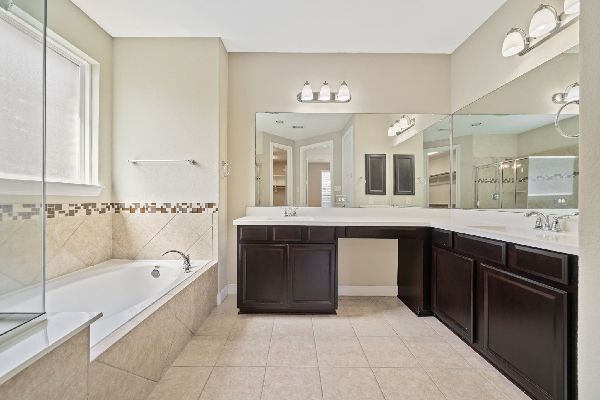 22523 Birch Ridge Meadow Drive Spring, TX 77389 - Photo 22 of 39 a spacious bathroom with a tub sink and mirror