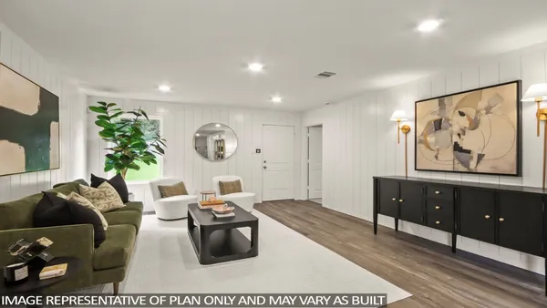 a living room with furniture and a dresser