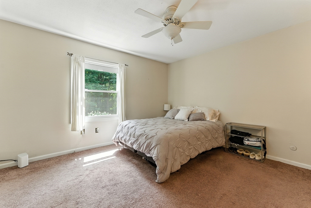 73 Yorktown Drive, Unit 73 Springfield, MA 01108 - Photo 15 of 42 a spacious bedroom with a bed and a window