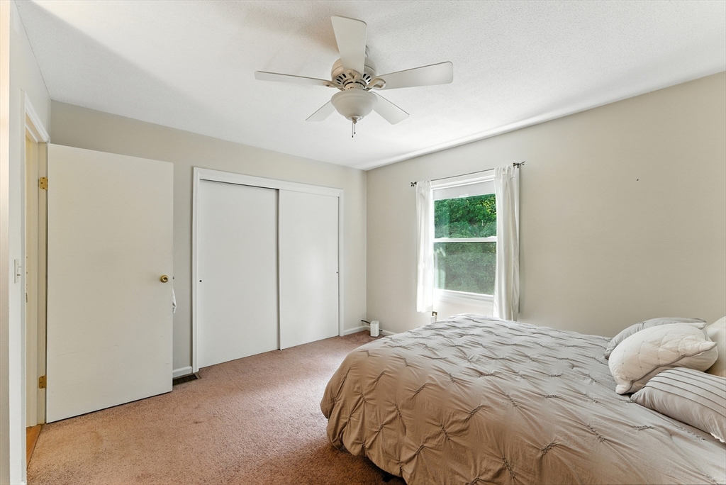 73 Yorktown Drive, Unit 73 Springfield, MA 01108 - Photo 17 of 42 a bedroom with a bed and a window