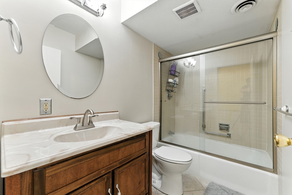 73 Yorktown Drive, Unit 73 Springfield, MA 01108 - Photo 18 of 42 a bathroom with a sink a toilet and shower