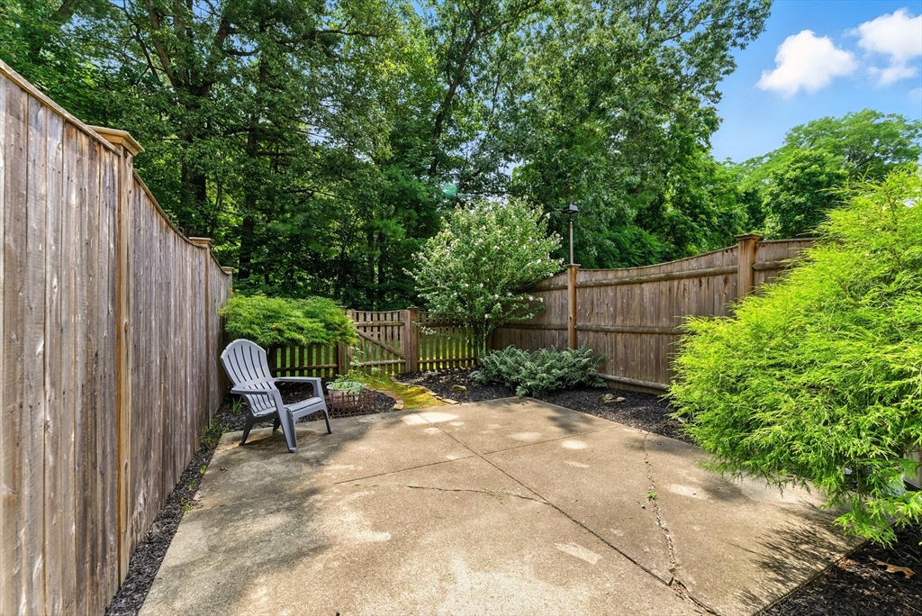 73 Yorktown Drive, Unit 73 Springfield, MA 01108 - Photo 23 of 42 a view of backyard with outdoor seating and green space
