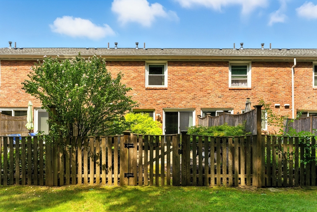 73 Yorktown Drive, Unit 73 Springfield, MA 01108 - Photo 27 of 42 a front view of a house with a garden