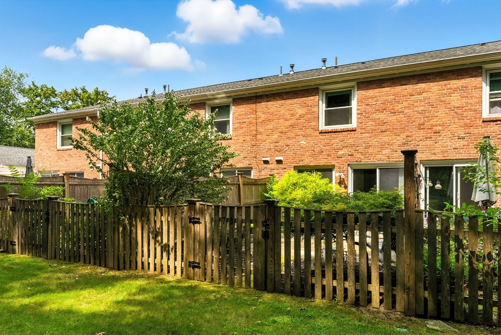 73 Yorktown Drive, Unit 73 Springfield, MA 01108 - Photo 28 of 42 a front view of a house with a garden