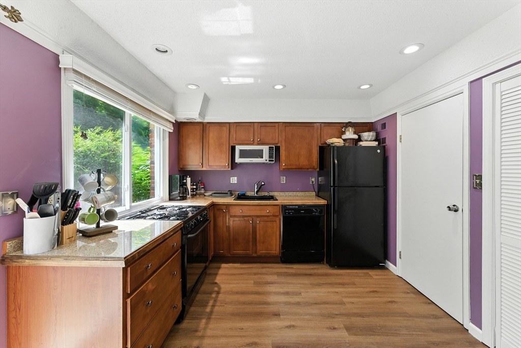 73 Yorktown Drive, Unit 73 Springfield, MA 01108 - Photo 9 of 42 a kitchen with a sink stove and refrigerator