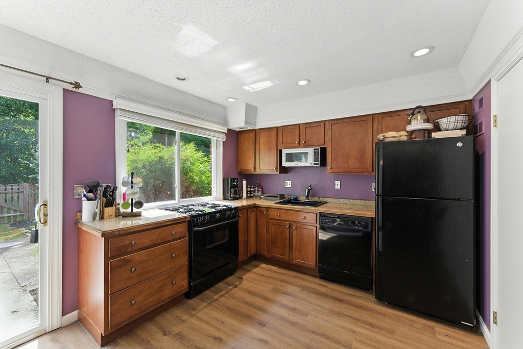 73 Yorktown Drive, Unit 73 Springfield, MA 01108 - Photo 10 of 42 a kitchen with a sink stove and refrigerator