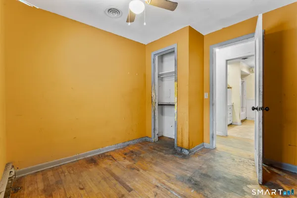 wooden floor in an empty room and a window