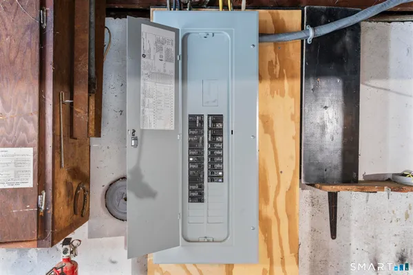 a bathroom with a granite countertop shower and mirror