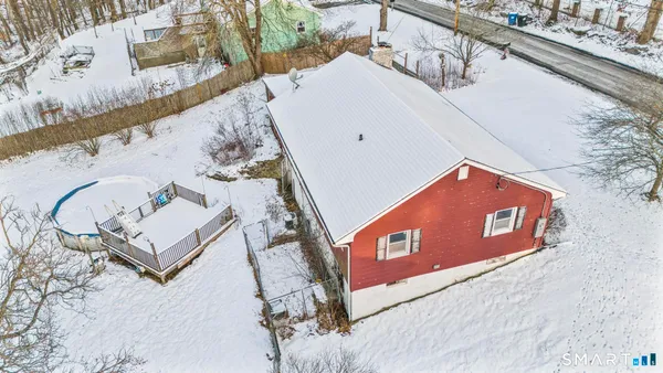 a view of living room with furniture and wooden floor