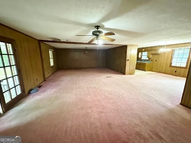 a view of empty room with windows