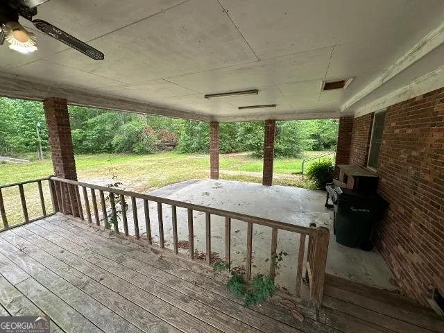a view of balcony with wooden floor