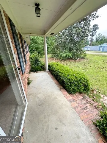 a view of a garden with an outdoor space
