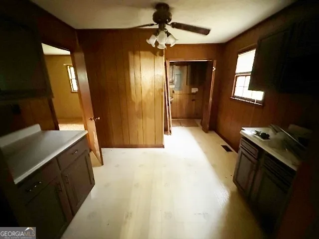 a bathroom with a sink a mirror and a shower