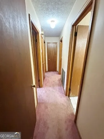 an entryway with a mirror