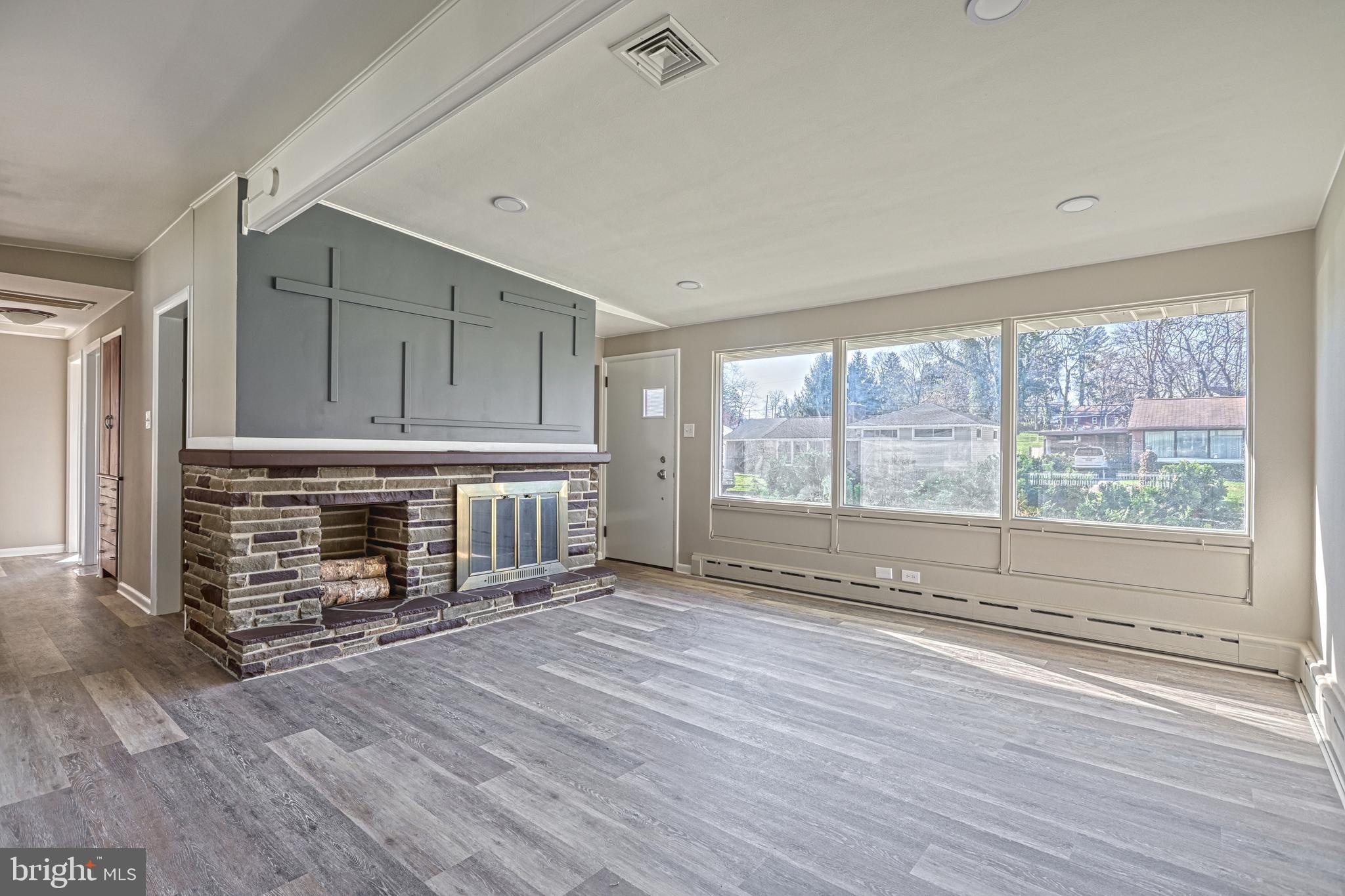13 Cornell Drive Camp Hill, PA 17011 - Photo 12 of 76 a view of an empty room with a fireplace and a window