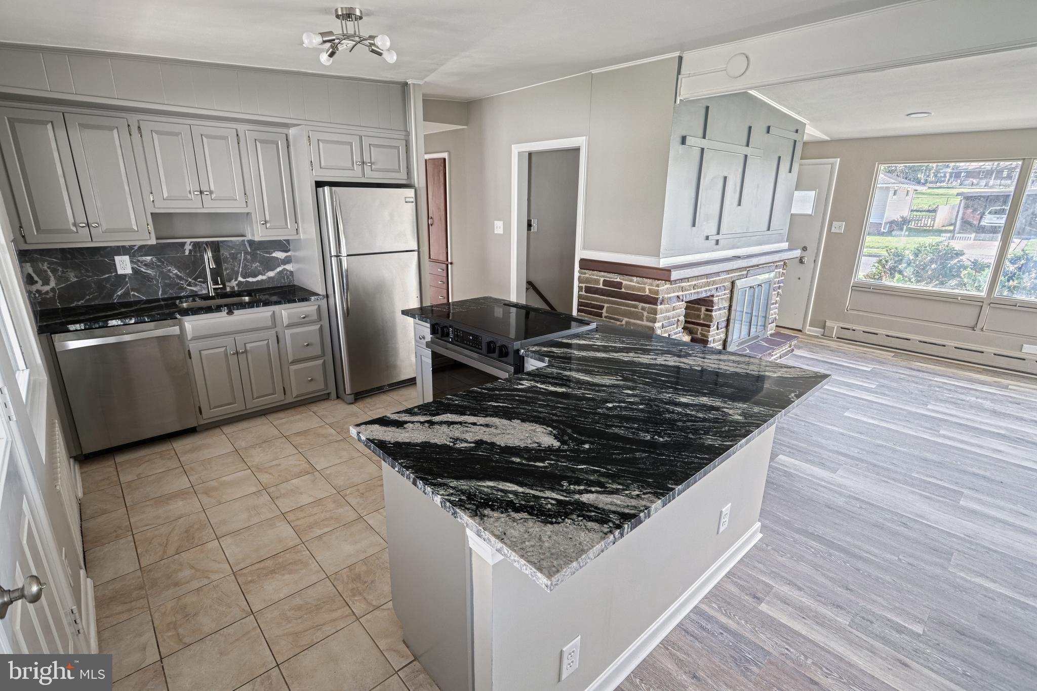 13 Cornell Drive Camp Hill, PA 17011 - Photo 21 of 76 a kitchen with a stove a sink and a refrigerator