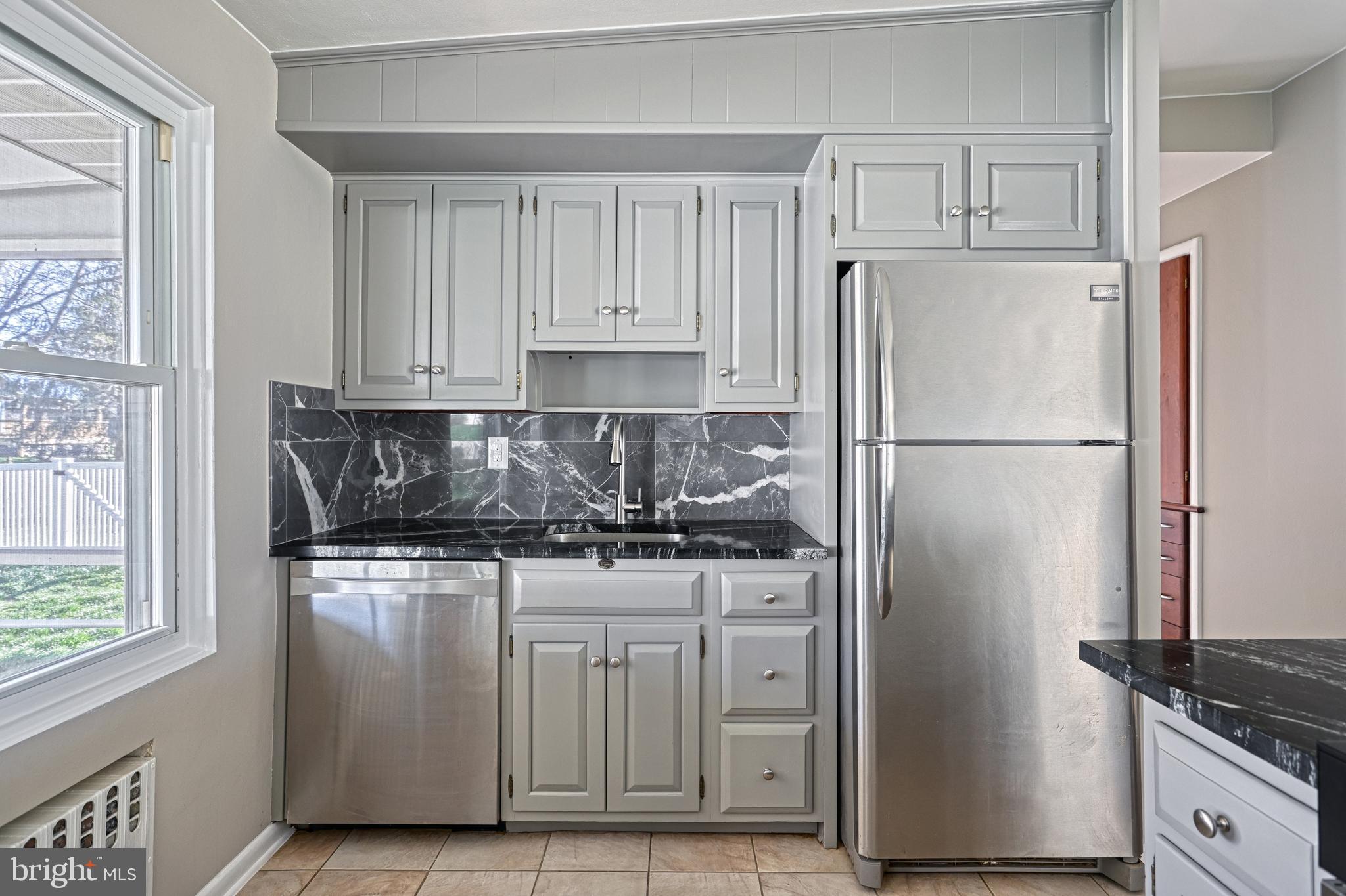 13 Cornell Drive Camp Hill, PA 17011 - Photo 22 of 76 a kitchen with stainless steel appliances granite countertop a refrigerator stove and a sink
