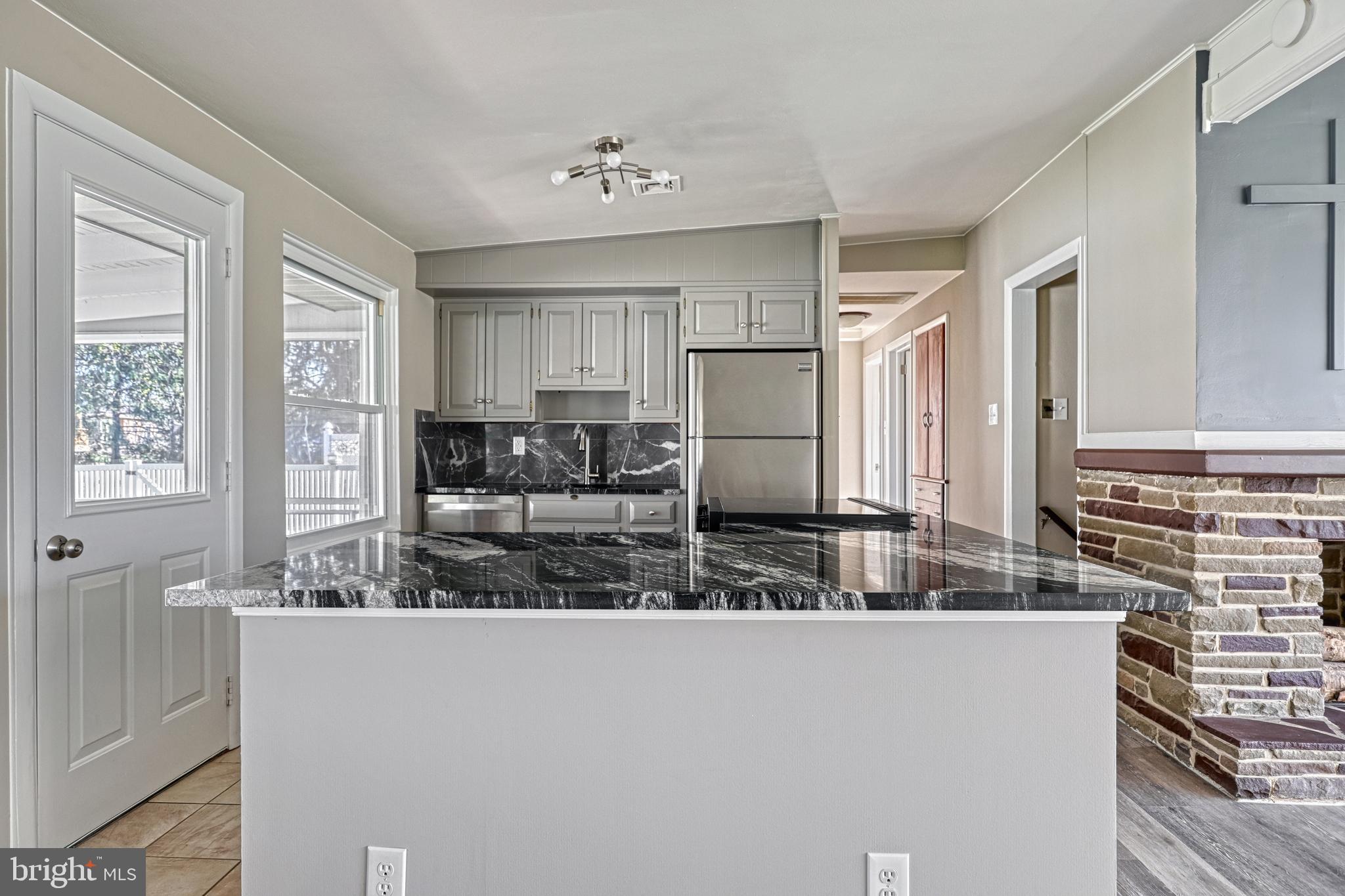13 Cornell Drive Camp Hill, PA 17011 - Photo 23 of 76 a kitchen with stainless steel appliances granite countertop a refrigerator and a stove top oven