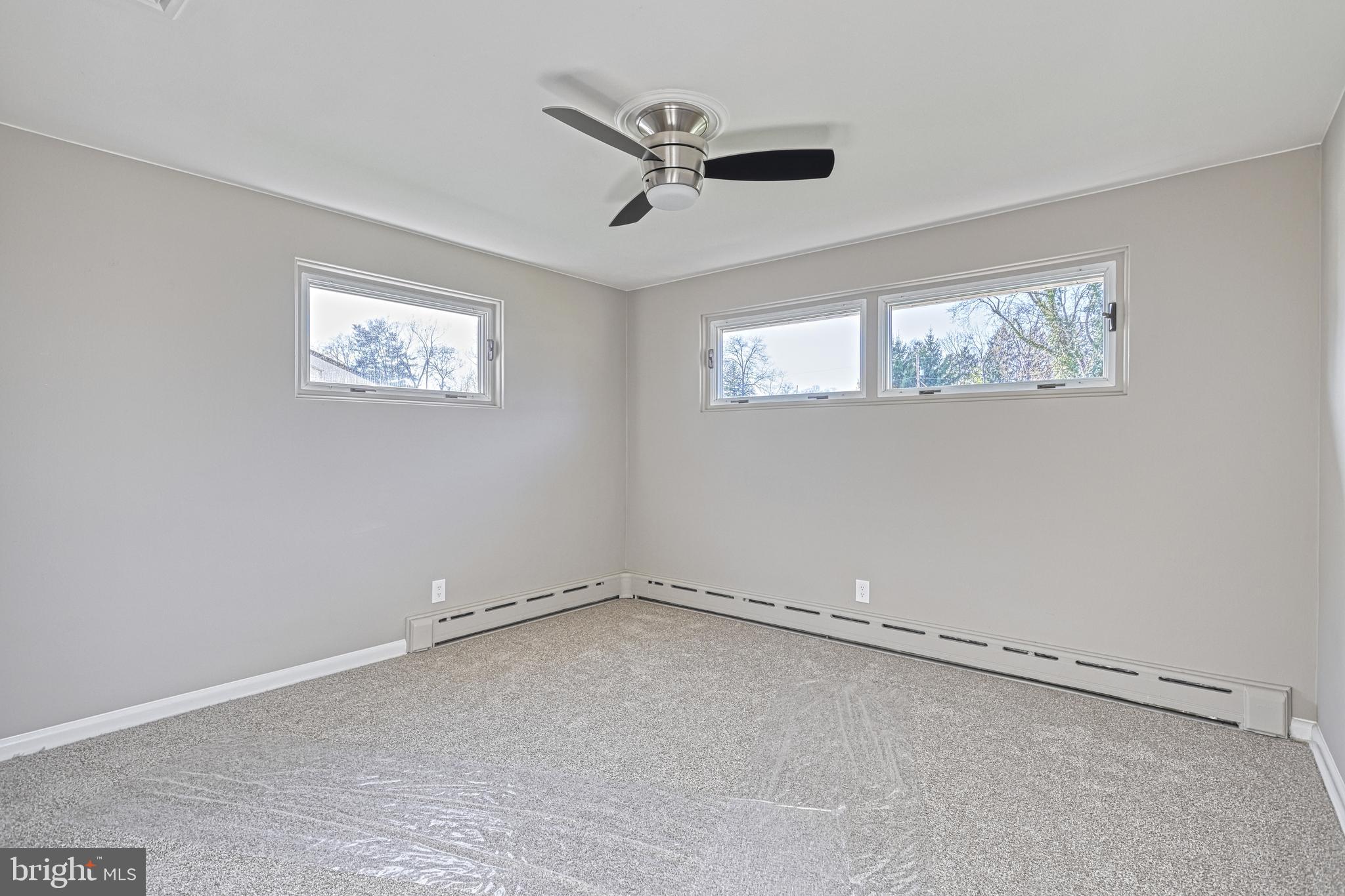 13 Cornell Drive Camp Hill, PA 17011 - Photo 32 of 76 an empty room with a window and ceiling fan
