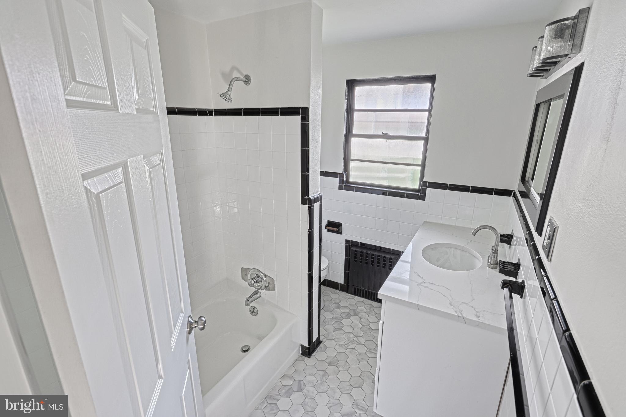 13 Cornell Drive Camp Hill, PA 17011 - Photo 35 of 76 a bathroom with a sink a toilet and shower