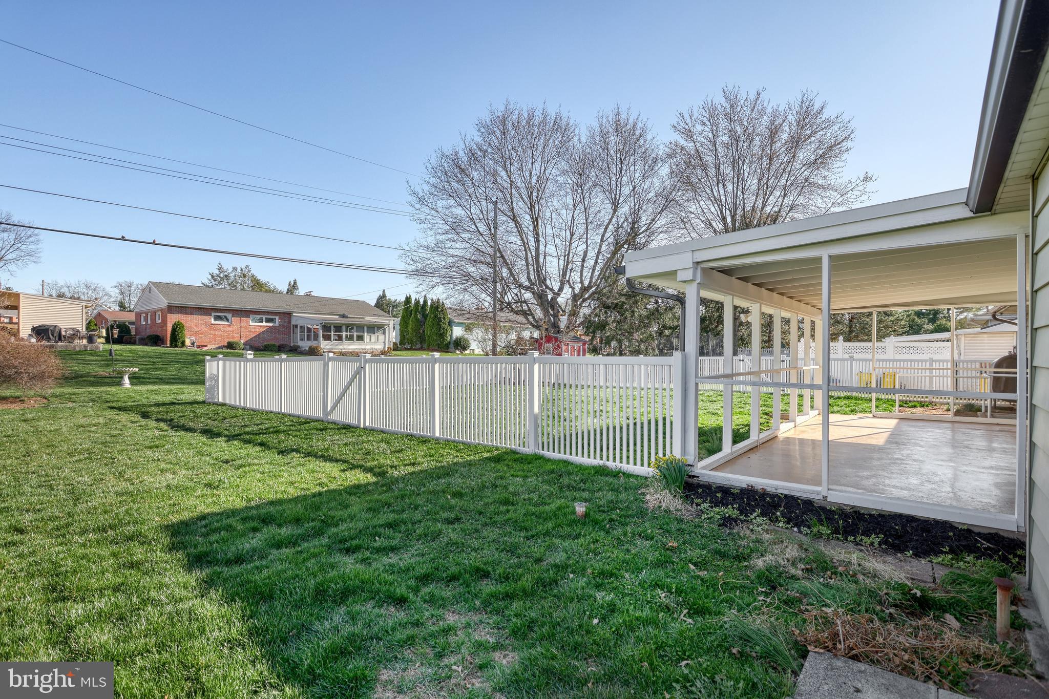 13 Cornell Drive Camp Hill, PA 17011 - Photo 51 of 76 a view of a backyard with couches under an umbrella