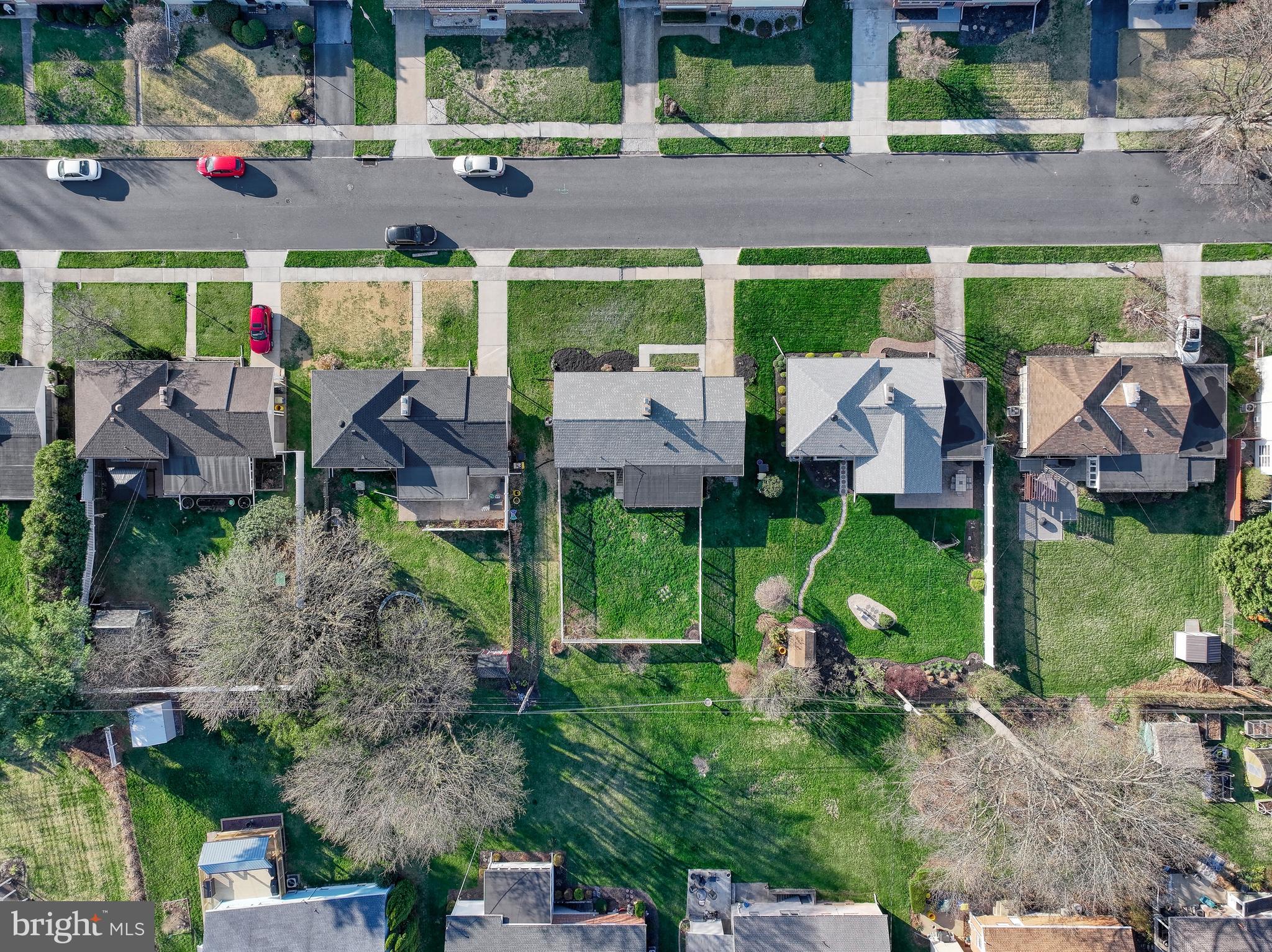 13 Cornell Drive Camp Hill, PA 17011 - Photo 70 of 76 a backyard of a house with lots of green space and fountain