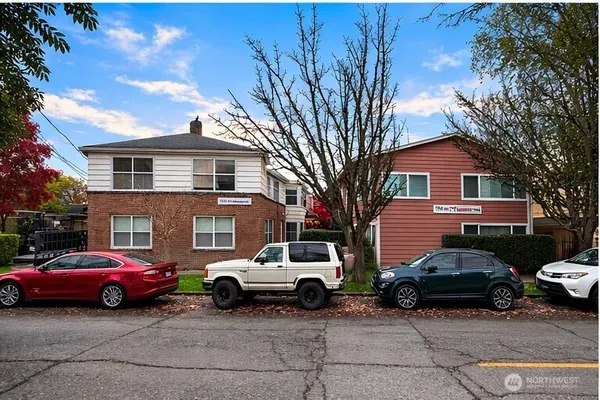 a view of a car parked in front of a house