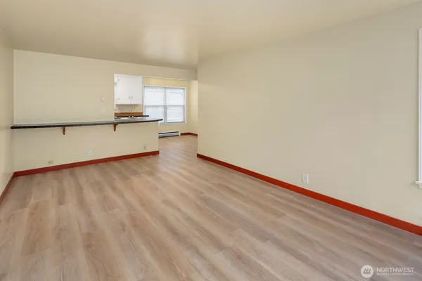 a kitchen with stainless steel appliances granite countertop a sink a stove a refrigerator a microwave and cabinets