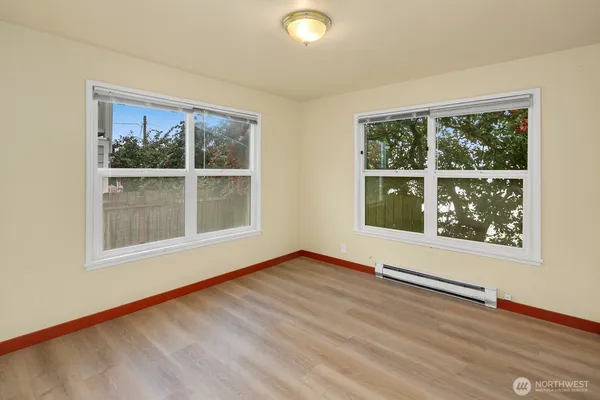 a view of an empty room with a window