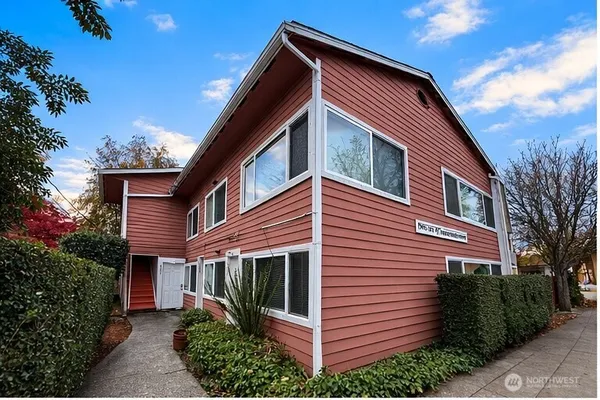 a view of a house with a backyard