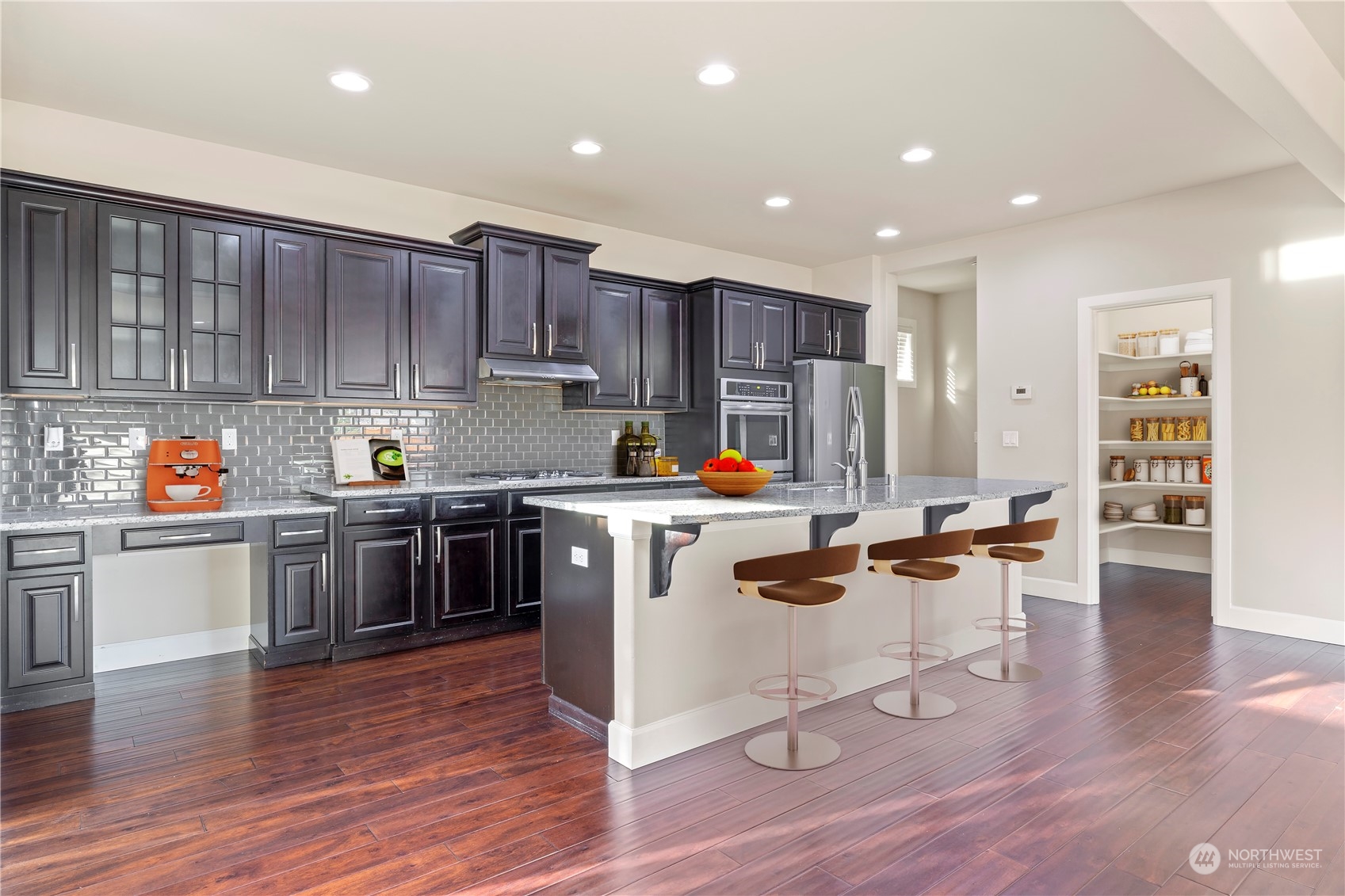 3312 170th Place Southeast Bothell, WA 98012 - Photo 4 of 29 a kitchen with a sink appliances cabinets and wooden floor